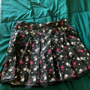 Hot topic size large skirt all with pink and white skulls on it.